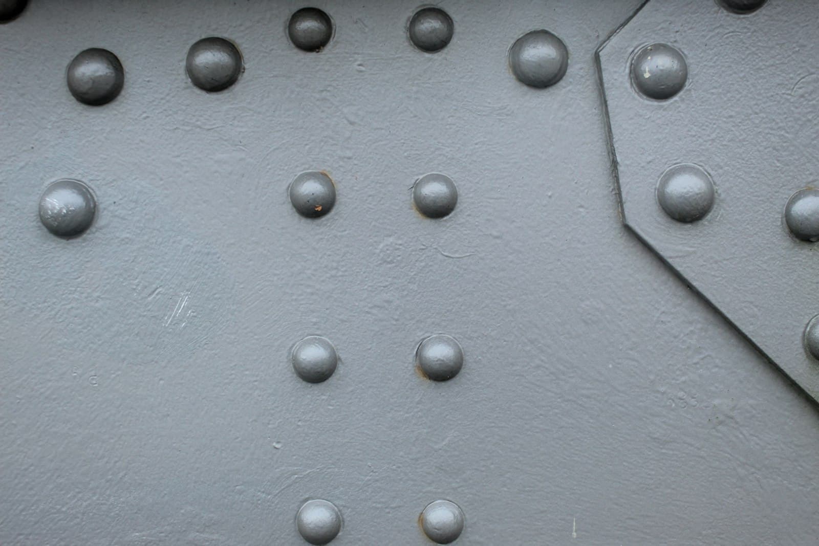 Close-up of blind rivets on a metal surface