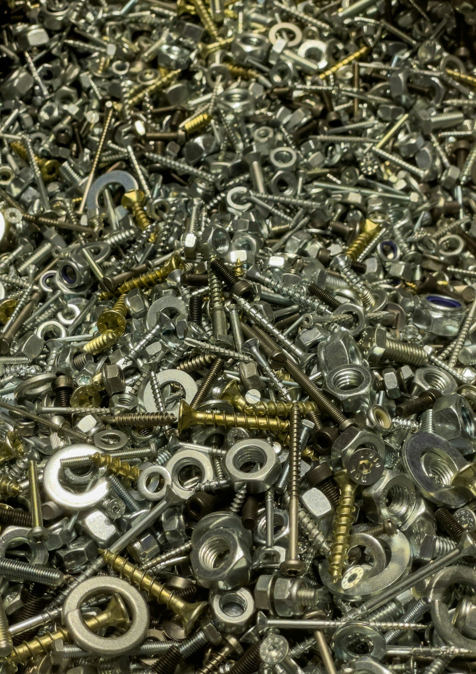 Assorted metal rings, nuts, and washers